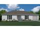 Charming single-story home featuring a classic design, lush landscaping, and a two-car garage at 521 Cardinal Dr, Poinciana, FL 34759