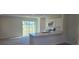 Modern kitchen featuring stainless steel appliances, white cabinets, and a convenient breakfast bar at 521 Cardinal Dr, Poinciana, FL 34759