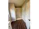 Bathroom featuring wood-look floors, stand-up shower with glass door and window at 3123 Crystal Hills Dr, Lakeland, FL 33801