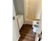 Functional bathroom with wood-look floors, single vanity, and a tub and shower combination at 3123 Crystal Hills Dr, Lakeland, FL 33801