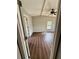 Bedroom with high ceilings, wood-look flooring, natural light, and entry to bathroom at 3123 Crystal Hills Dr, Lakeland, FL 33801