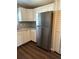 Kitchen features white cabinetry, updated countertops, and stainless steel refrigerator at 3123 Crystal Hills Dr, Lakeland, FL 33801