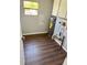 The utility room features wood-look flooring, water heater, and storage cabinets at 3123 Crystal Hills Dr, Lakeland, FL 33801