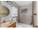 Bathroom with standard fixtures, tiled walls and a stained bathtub at 3800 Levins Rd, Mulberry, FL 33860