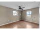 Empty bedroom with natural light and hardwood floor at 3800 Levins Rd, Mulberry, FL 33860