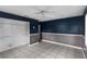 Bedroom with blue accent walls, a ceiling fan, and an empty closet at 3800 Levins Rd, Mulberry, FL 33860