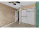 Bedroom with sliding closet door and empty closet at 3800 Levins Rd, Mulberry, FL 33860