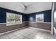 Bedroom with white tile floor, and windows with natural light at 3800 Levins Rd, Mulberry, FL 33860