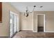 Dining area with tiled floor has chandelier and access to the exterior at 3800 Levins Rd, Mulberry, FL 33860