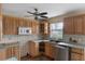 Traditional kitchen features wood cabinets, tile backsplash, and stainless steel appliances at 3800 Levins Rd, Mulberry, FL 33860
