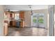Kitchen featuring light-colored cabinets, tile flooring and French doors leading to the backyard at 3800 Levins Rd, Mulberry, FL 33860