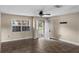 Living room featuring tile flooring, neutral-colored walls, and a door leading to the front yard at 3800 Levins Rd, Mulberry, FL 33860