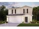 Charming two-story home with a two-car garage, well-maintained lawn, and complementary landscaping at 1988 Golden Beak Dr, Eagle Lake, FL 33839