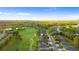 Aerial shot highlights the property's ideal location close to lush fairways and green community at 26922 White Plains Way, Leesburg, FL 34748