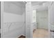 Walk-in closet adjacent to bathroom offers convenient storage at 26922 White Plains Way, Leesburg, FL 34748