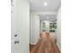 Bright foyer features light walls and wood-look flooring throughout at 26922 White Plains Way, Leesburg, FL 34748