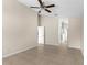 Spacious bedroom with tile flooring, a ceiling fan, and easy access to other rooms at 580 Tree Shore Dr, Orlando, FL 32825