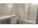 Clean bathroom with a single sink vanity and tiled stand up shower at 53 Orchid Ct, Poinciana, FL 34759