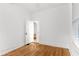 Hardwood floored bedroom featuring white walls and natural lighting at 1309 Sanford Ave, Sanford, FL 32771