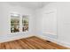 Cozy bedroom featuring hardwood floors, white walls and natural lighting at 1309 Sanford Ave, Sanford, FL 32771