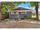 Charming single-story home featuring gray siding, two windows and a landscaped front yard at 1309 Sanford Ave, Sanford, FL 32771