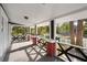 Expansive covered front porch with brick and white columns and decorative railings at 1309 Sanford Ave, Sanford, FL 32771