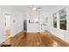 Bright and airy living room with hardwood floors, white walls, and a ceiling fan at 1309 Sanford Ave, Sanford, FL 32771