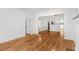 Open living room with hardwood flooring that transitions into the kitchen area at 1309 Sanford Ave, Sanford, FL 32771