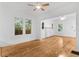 Spacious living room featuring hardwood floors, white walls, and an open layout at 1309 Sanford Ave, Sanford, FL 32771