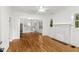 Bright and spacious living room with hardwood floors, a white fireplace, and plenty of natural light at 1309 Sanford Ave, Sanford, FL 32771