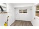 Utility room features laminate flooring and window for natural light and water heater at 1309 Sanford Ave, Sanford, FL 32771