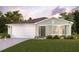 Charming single-story home with well-maintained lawn and attached two-car garage at 1023 Derbyshire Dr, Kissimmee, FL 34758