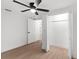 Neat bedroom featuring hardwood floors, closet, and ceiling fan at 760 S Park Ave, Winter Garden, FL 34787