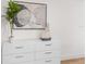 Neutral bedroom decor featuring modern art and vases on a white dresser at 760 S Park Ave, Winter Garden, FL 34787