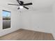 Bright, airy bedroom with hardwood floors and a ceiling fan at 760 S Park Ave, Winter Garden, FL 34787