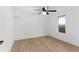 Bright bedroom featuring a ceiling fan and wood-look flooring at 760 S Park Ave, Winter Garden, FL 34787