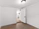 Clean bedroom featuring hardwood floors and access to the kitchen at 760 S Park Ave, Winter Garden, FL 34787