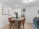 Elegant dining room with a stylish table, comfortable chairs, and modern decor at 760 S Park Ave, Winter Garden, FL 34787