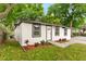 Charming single-story home with a well-manicured lawn and fresh landscaping, creating inviting curb appeal at 760 S Park Ave, Winter Garden, FL 34787