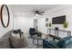 Comfortable living room with a gray sofa, blue accent chairs, and stylish decor at 760 S Park Ave, Winter Garden, FL 34787