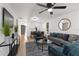 Bright living room showcasing stylish furnishings, wood-look floors, and an open concept design at 760 S Park Ave, Winter Garden, FL 34787