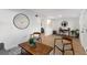 Open concept living room with modern furniture, wood-look floors, and bright, white walls at 760 S Park Ave, Winter Garden, FL 34787