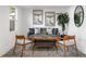 Bright living room with modern decor, gray sofa, stylish wooden chairs and a decorative rug at 760 S Park Ave, Winter Garden, FL 34787