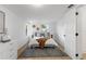 Bright bedroom with neutral decor, natural light, and wood-look flooring at 760 S Park Ave, Winter Garden, FL 34787