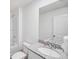 Clean bathroom featuring a white vanity with granite countertop, white toilet, and shower with white tile at 540 Glade Ct, Kissimmee, FL 34758