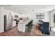 Open kitchen featuring stainless steel appliances, a kitchen island with bar seating, and adjacent dining space at 540 Glade Ct, Kissimmee, FL 34758