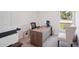 Bright home office featuring a modern desk, comfortable chairs, and a large window with a view of the outdoors at 540 Glade Ct, Kissimmee, FL 34758