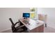 Clean home office featuring a modern desk, comfortable chair, and a large window with a view of the outdoors at 540 Glade Ct, Kissimmee, FL 34758