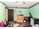 Bedroom with green walls, natural light, ceiling fan, and closet at 1915 Poinsettia Dr, Port Orange, FL 32128