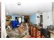 Open floor plan showcasing the living room and kitchen with a stone fireplace feature at 1915 Poinsettia Dr, Port Orange, FL 32128